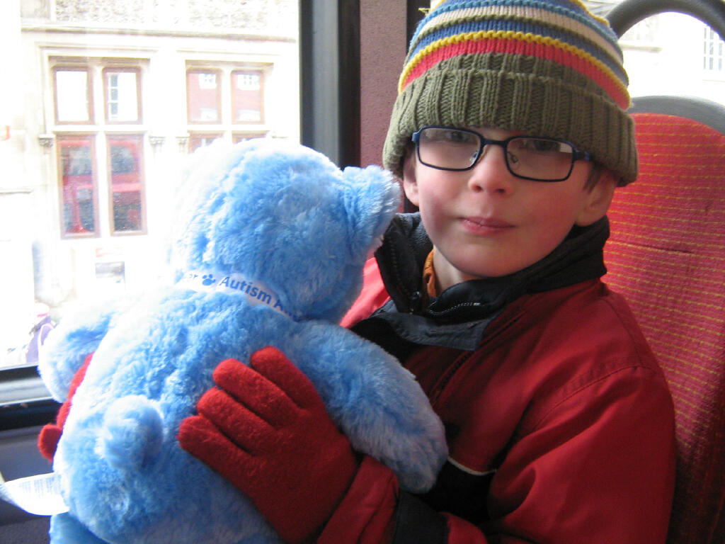 my son with his Autism Awareness bear
